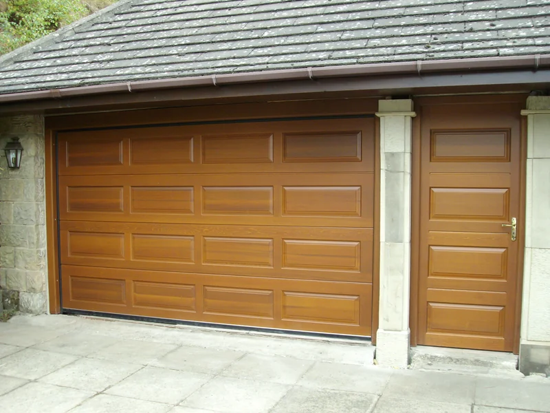Oak effect sectional garage door with side door