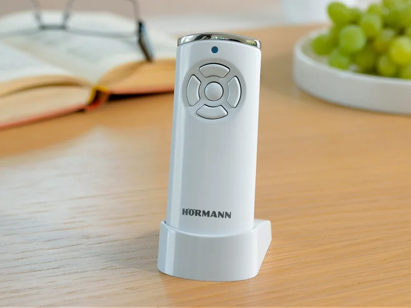 Garage door remote handset on a table
